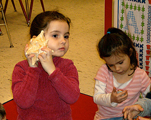 Childs with seashells