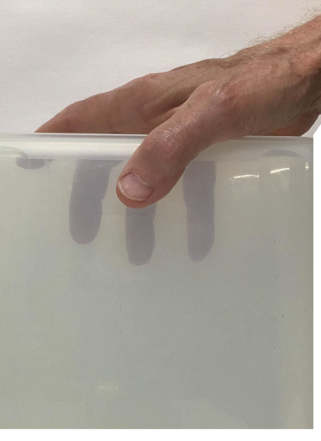 holding a box from above in front of the body.