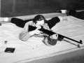 Rifle practice, circa 1950<br/>Despite having heavy courseloads, students still found time to pursue extracirricular activites. The Rifle Club in the lower level of the Women's Athletic Building by Mosher-Jordan was especially popular.